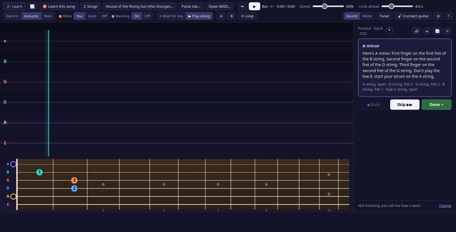 The coach teaching A minor: its shape lit on the fretboard with a finger number on each fret, and the instructions beside it