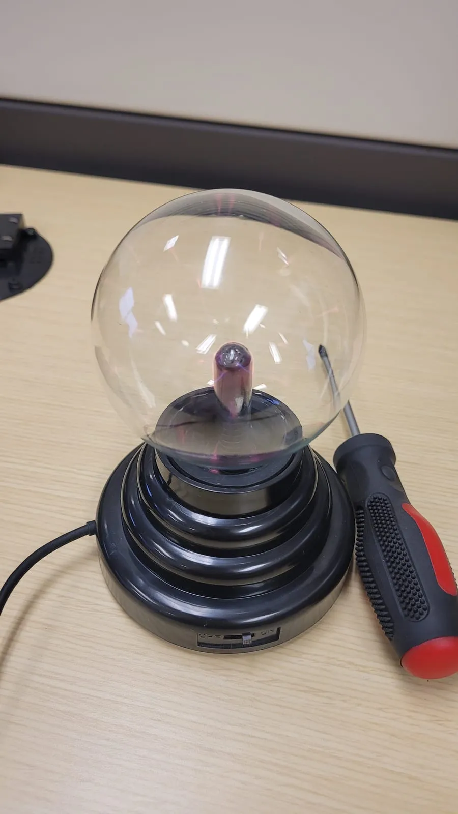 The plasma globe lit up, looking like an ordinary desk toy