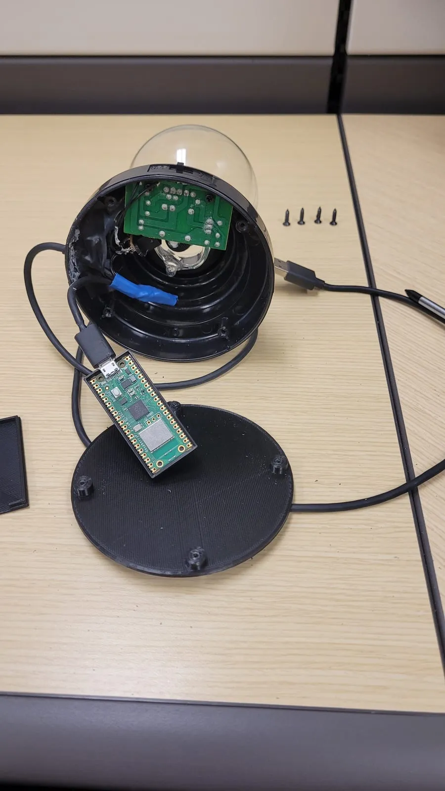 The base opened up: the globe's own driver board, the Raspberry Pi Pico W on its printed mount, and the printed bottom plate